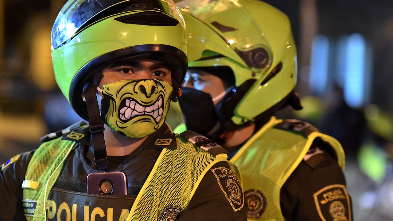 Police officers wearing colorful face masks in Cali, Colombia on March 20 as preventative measures began.