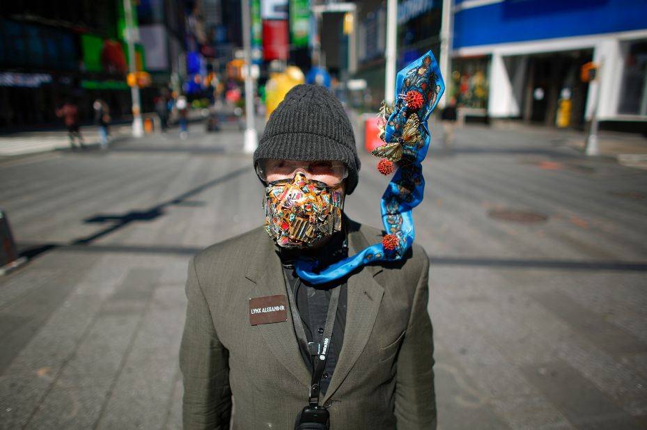 Artist Lynx Alexander wears a mask in New York's Times Square.