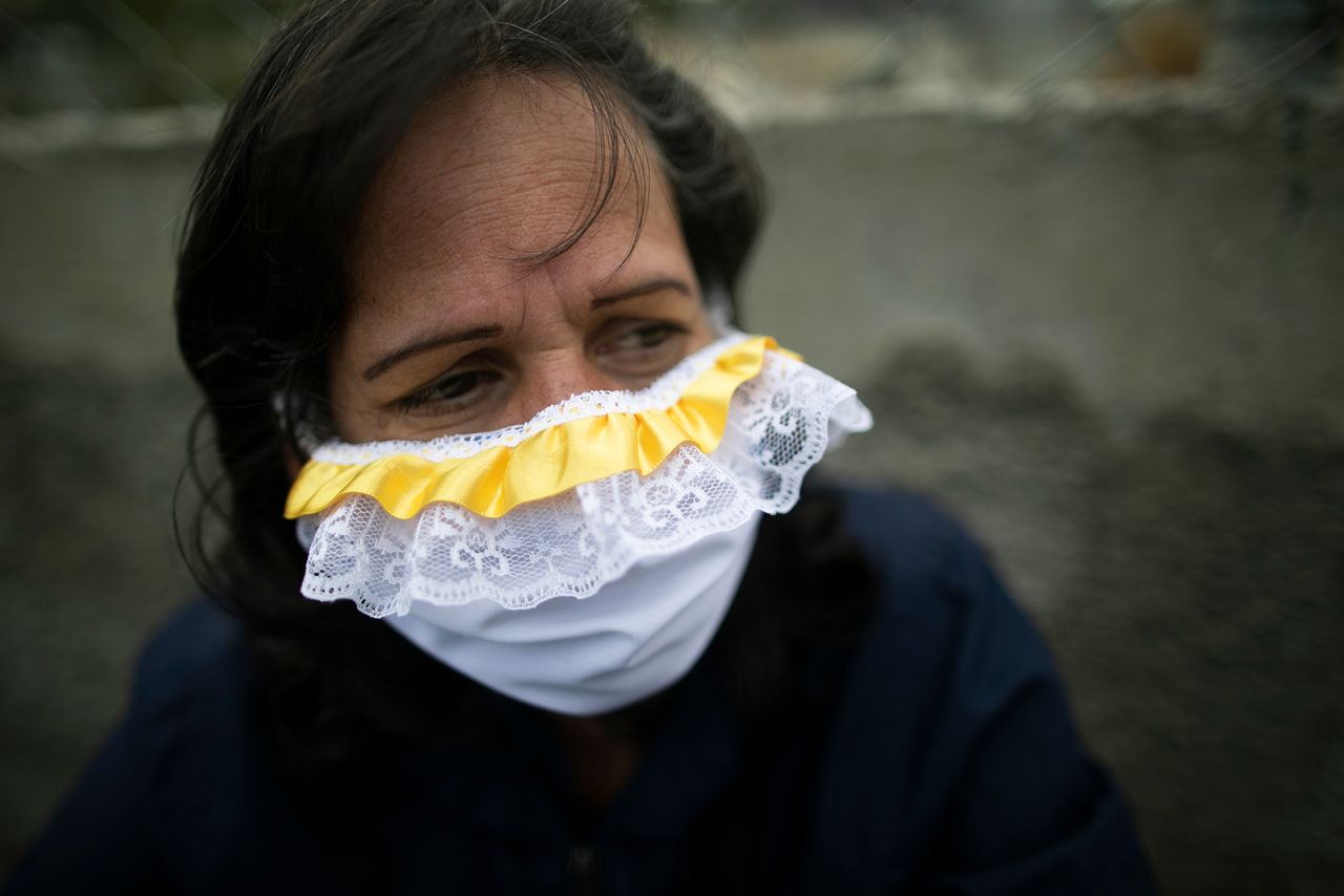 A woman waits in line to buy food in Caracas, Venezuela.