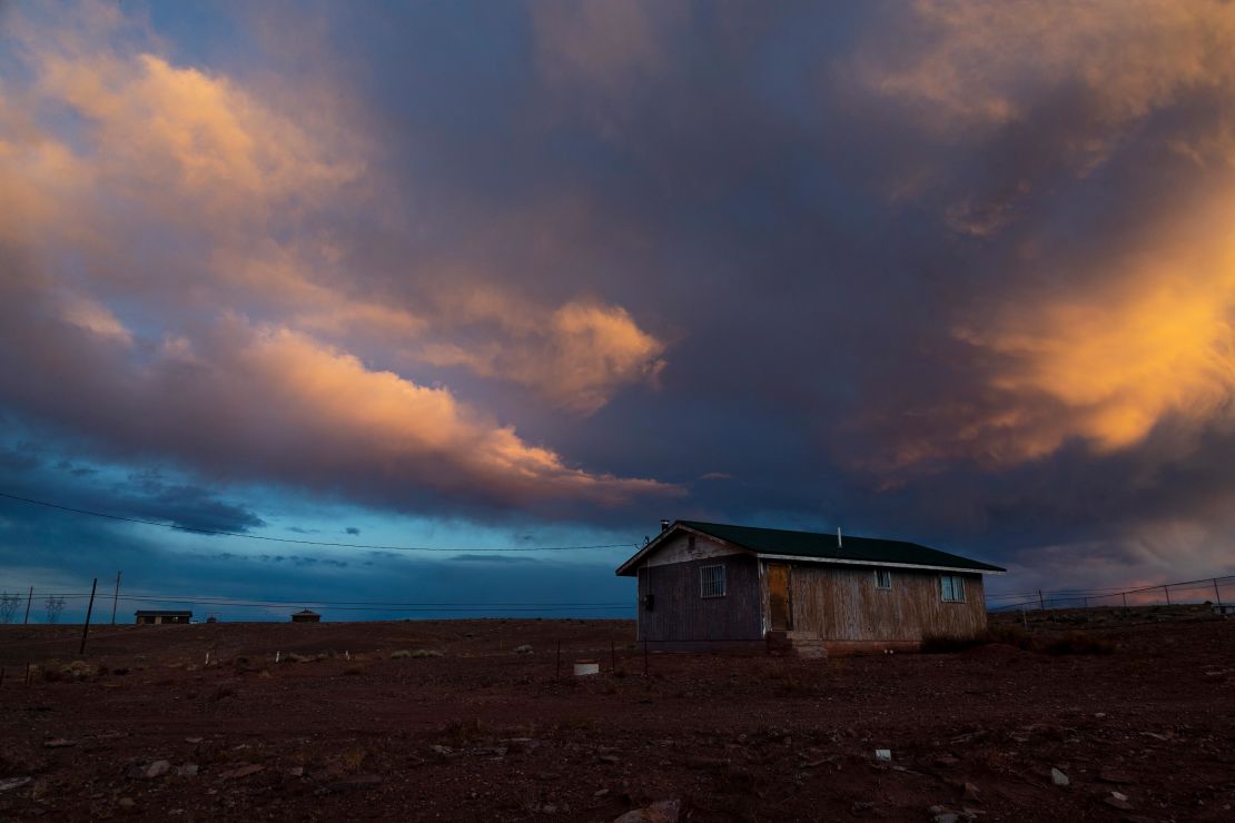 Storm clouds pass over one of many rural homes on the Navajo reservation, which do not have electricity or running water during the coronavirus pandemic in March 2020 in Cameron, Arizona.