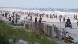 JACKSONVILLE BEACH, FL - APRIL 17: People crowded the beaches in its first open hour on April 17, 2020 in Jacksonville Beach, Fl. Jacksonville Mayor Lenny Curry opened the beaches to residents for limited activities for the first time in weeks since closing them to the public due to the Coronavirus (COVID-19) outbreak. Jacksonville Beach became the first beach in the country to reopen. (Photo by David Rosenblum/Icon Sportswire via Getty Images)