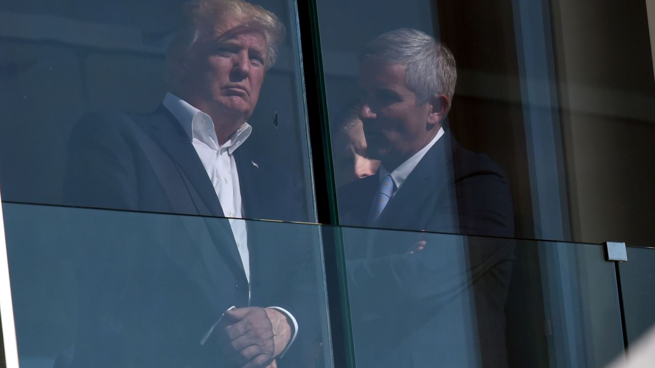 Monahan speaks with Trump at the Liberty National Golf Club.