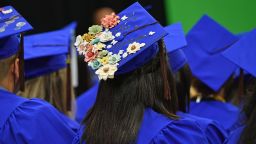 NEW YORK, NY - MAY 25:  Students wear decorated graduation caps during The Fashion Institute of Technology's 2017 Commencement Ceremony at Arthur Ashe Stadium on May 25, 2017 in New York City.  (Photo by Dia Dipasupil/Getty Images for The Fashion Institute of Technology)
