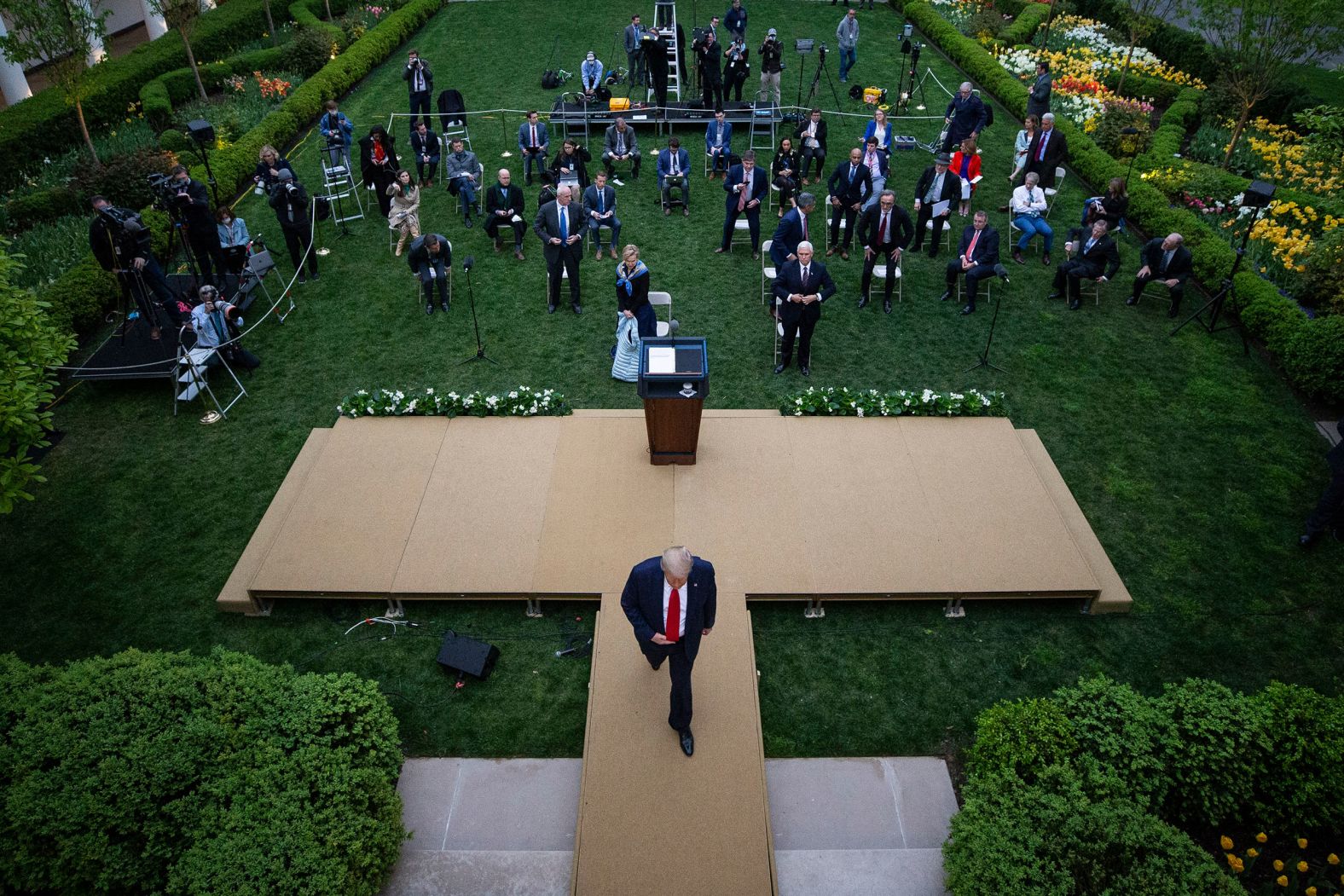 Trump departs from the White House Rose Garden following the coronavirus briefing on April 14. During the briefing, Trump threatened to leave after Playboy correspondent and CNN analyst Brian Karem attempted to ask a question about social distancing. "Quiet. Quiet." Trump said. When Karem continued to ask his question, Trump interjected: "If you keep talking, I'll leave and you can have it out with the rest of these people. If you keep talking, I'm going to leave and you can have it out with them. Just a loudmouth."