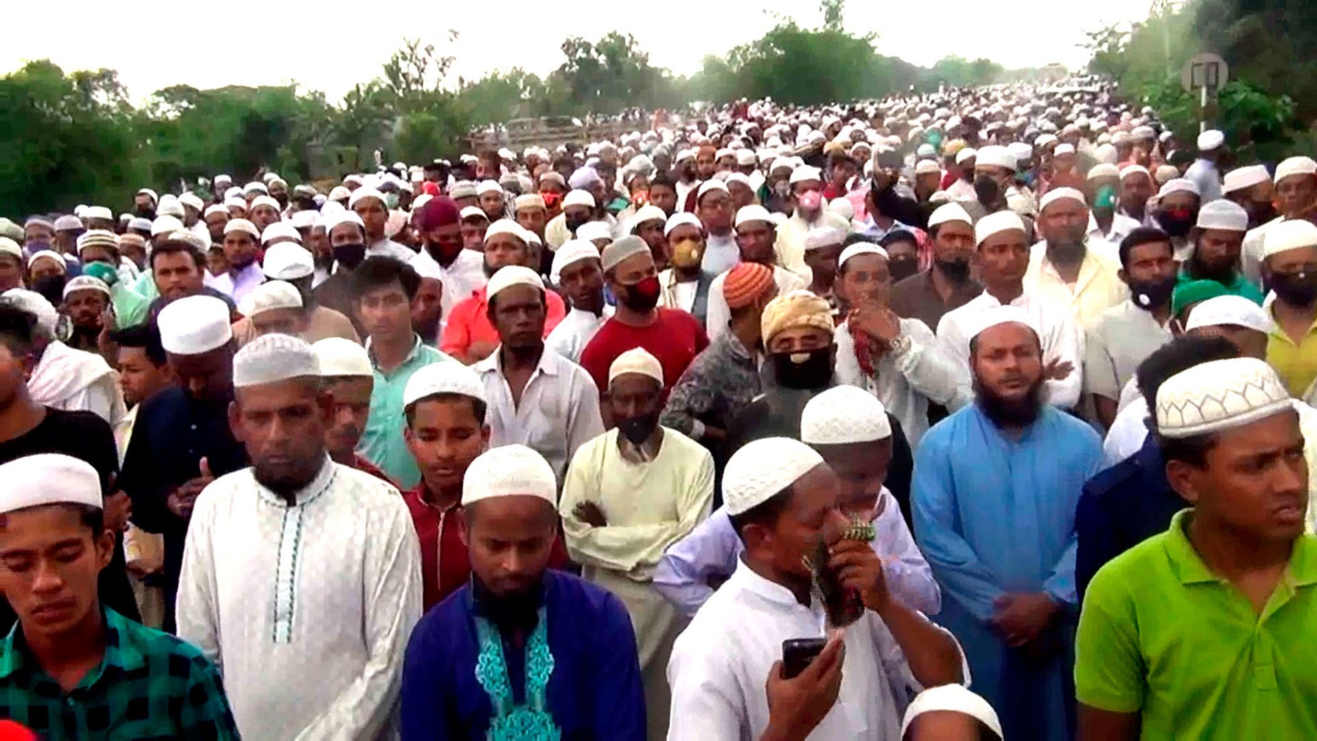 Thousands of Bangladeshi Muslims gather for the funeral of a popular Islamic preacher on Saturday, April 18, 2020.