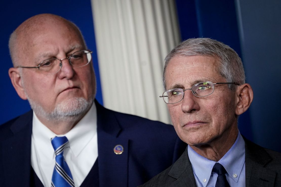 CDC Director Robert Redfield and Dr. Anthony Fauci, director of the National Institute of Allergy and Infectious Diseases, attend a briefing on the administration's coronavirus response. (Photo by Drew Angerer/Getty Images)