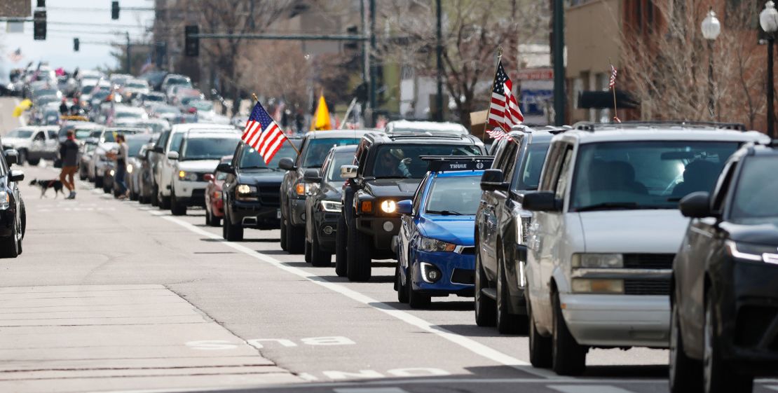 Vehicles stack up  in Boulder during a car protest against the stay-at-home order issued by Colorado Gov. Jared Polis on Sunday, April 19, 2020. 