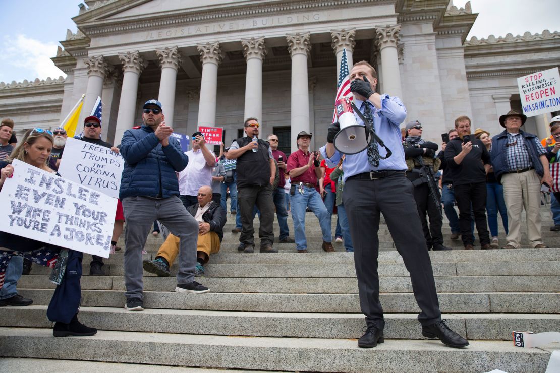 Gubernatorial candidate Tim Eyman speaks during a rally to protest Washinton state's stay-at-home order at the Capitol building Sunday in Olympia.