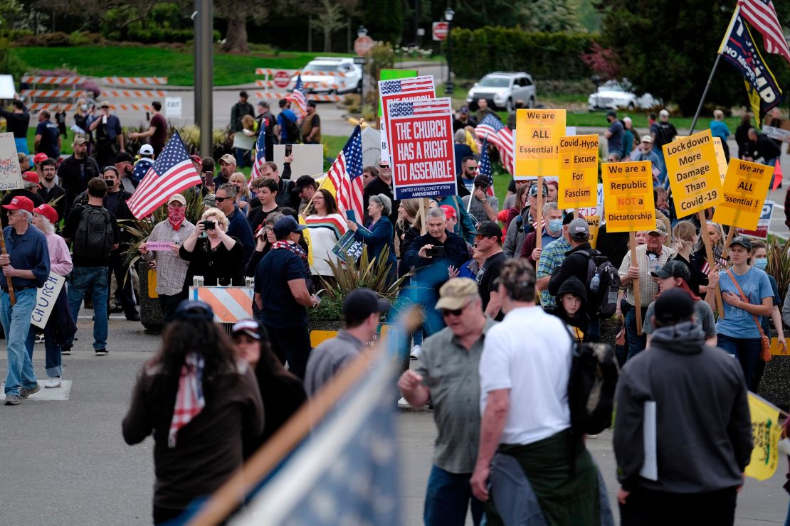 Hundreds of protesters gather around the Capitol in Olympia, Washington, on April 19, 2020.