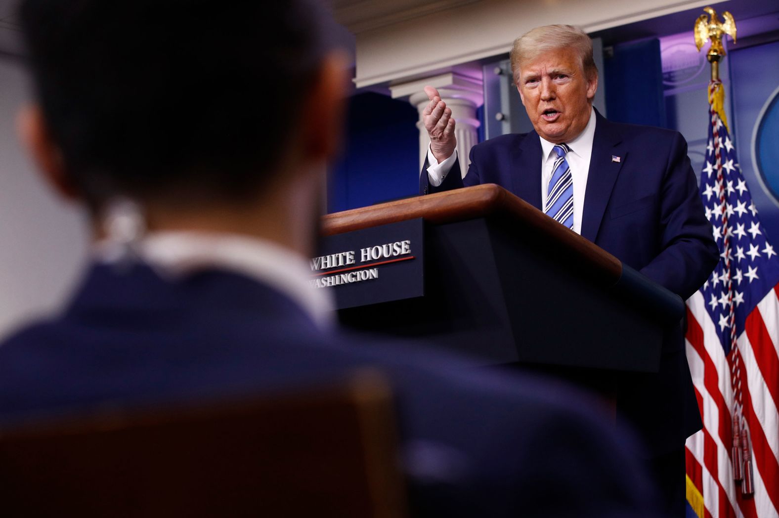 Trump responds to a question from CNN's Jeremy Diamond during the White House coronavirus briefing on April 19. When pressed by Diamond as to why he was taking time during briefing to<a href="index.php?page=&url=https%3A%2F%2Fwww.cnn.com%2Fworld%2Flive-news%2Fcoronavirus-pandemic-04-19-20-intl%2Fh_518ef7f7b57941c3ce031ad63ff129ac" target="_blank"> discuss praise he has received</a> while millions of Americans were unemployed and tens of thousands had died, Trump said he was "standing up for the men and women who have done such an incredible job," not for himself. "It's not about me. Nothing is about me," he said. The clips Trump played at the briefing praised himself and not health-care workers.