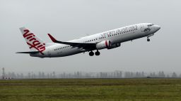 A Boeing Co. 737 aircraft operated by Virgin Australia Holdings Ltd. takes off from Sydney Airport in Sydney, Australia, on Thursday, March 5, 2020. Virgin Australia, part of billionaire entrepreneur Richard Branson's?Virgin Group, warned last week that the coronavirus is expected to reduce earnings by A$50 million ($33 million) to A$75 million in the second half of 2020. Photographer Brendon Thorne/Bloomberg via Getty Images