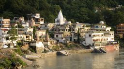 Rishikesh, Uttaranchal, India. Sant Sewa Ashram. Lakshman Jhula. Rishikesh. India.  Rishikesh, also spelled Hrishikesh, Rushikesh, or Hrushikesh, is a city and a municipal board in Dehradun district in the Indian state of Uttarakhand.It is surrounded by two other districts namely Tehri Garhwal and Pauri Garhwal. It is located in the foothills of the Himalaya in northern India and attracts thousands of pilgrims and tourists each year, from within India, as well as from other countries. Rishikesh is a vegetarian city by law, as well as an alcohol-free city. Rishikesh has also banned use of plastics bags by shopkeepers and vendors. Rishikesh, sometimes nicknamed "the world capital of Yoga", has numerous yoga centres that also attract tourists. It is believed that meditation in Rishikesh brings one closer to attainment of moksha, as does a dip in the holy river that flows through it. Rishikesh is world famous for Rafting and Adventure. Rafting season starts from the month of March and ends in July. Rishikesh is also home to the 120-year old Kailas Ashram Brahmavidyapeetham, an institution dedicated to preserve and promote the traditional Vedantic Studies. Prominent personalities such as Swami Vivekananda, Swami Rama Tirtha and Swami Shivananda have studied in this institution. In February 1968, The Beatles visited the now-closed Maharishi Mahesh Yogi's ashram in Rishikesh.[6] John Lennon recorded a song titled, 'The Happy Rishikesh Song'.[7][8] The Beatles composed nearly 48 songs during their time at the Maharishi's ashram, many of which appear on the White Album. Several other artists visited the site to contemplate and meditate. Photo by: Sergi Reboredo/picture-alliance/dpa/AP Images