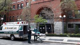In this Friday, April 17, 2020 photo, emergency medical workers arrive at a nursing home in the Brooklyn borough of New York. 