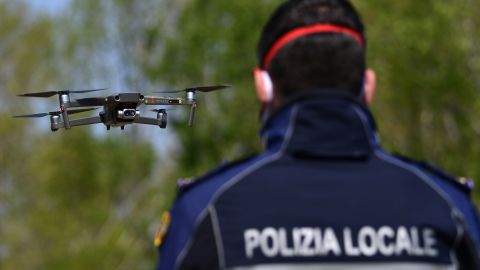 A police officer pilots a DJI Mavic 2 Enterprise drone with a thermal sensor for checking people's temperature on April 9 in Treviolo, near Bergamo, Italy.