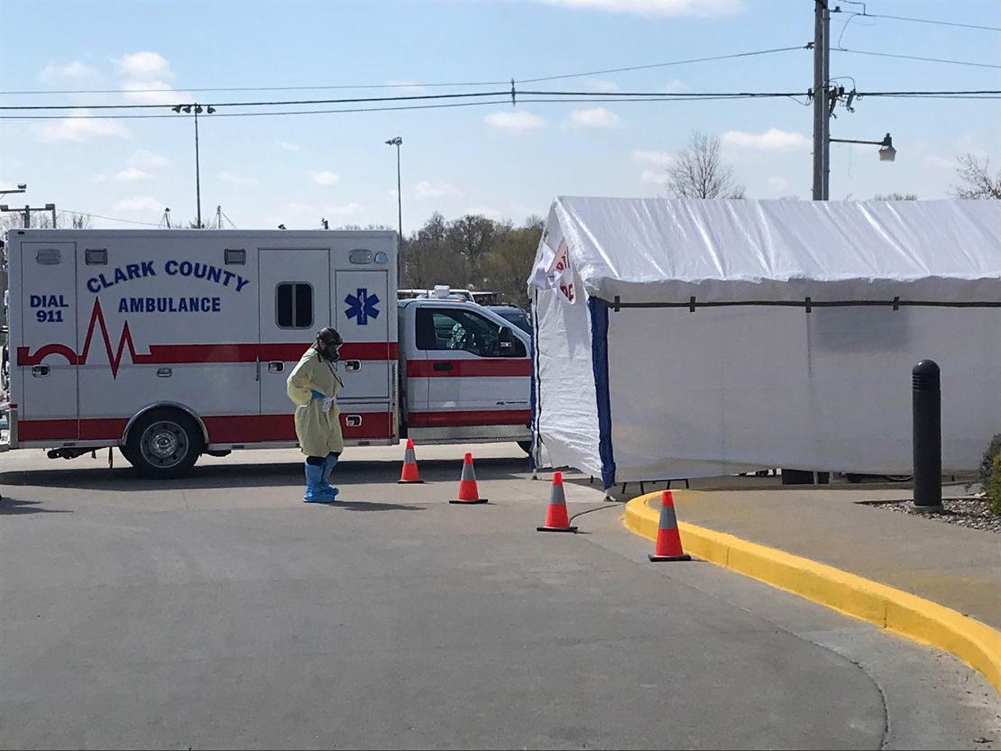 An emergency room worker at Memphis, Missouri's Scotland County Hospital prepares to triage incoming patients.