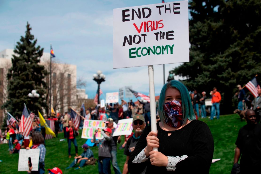 Demonstrators gather at the Colorado state Capitol to protest coronavirus stay-at-home orders during a "ReOpen Colorado" rally in Denver on April 19. 