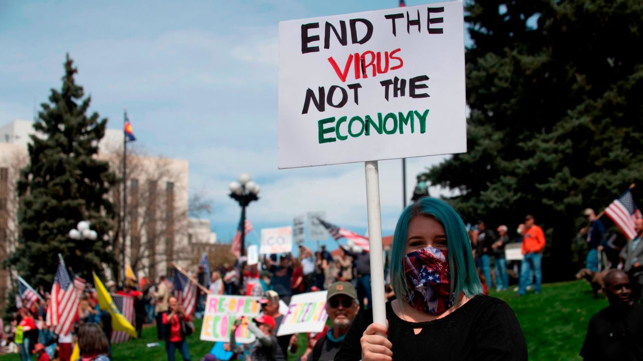 Demonstrators gather at the Colorado state Capitol to protest coronavirus stay-at-home orders during a "ReOpen Colorado" rally in Denver on April 19. 