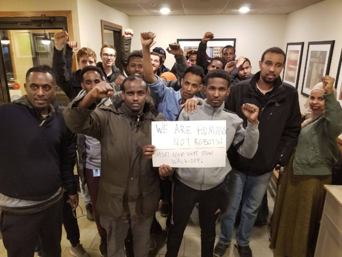 Employees from Amazon's Shakopee facility gather after worker action in March 2019. "We don't want them to treat us as robots," Mohamed told CNN Business.