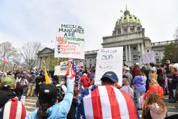 People take part in a "reopen" Pennsylvania demonstration on April 20, 2020 in Harrisburg, Pennsylvania. - Hundreds have protested in cities across America against coronavirus-related lockdowns -- with encouragement from President Donald Trump -- as resentment grows against the crippling economic cost of confinement. 