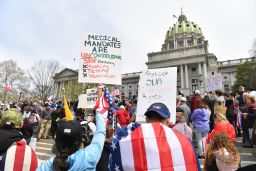 People take part in a "reopen" Pennsylvania demonstration on April 20, 2020 in Harrisburg, Pennsylvania. - Hundreds have protested in cities across America against coronavirus-related lockdowns -- with encouragement from President Donald Trump -- as resentment grows against the crippling economic cost of confinement.