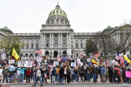 People take part in a "reopen" Pennsylvania demonstration on April 20, 2020 in Harrisburg, Pennsylvania. - Hundreds have protested in cities across America against coronavirus-related lockdowns -- with encouragement from President Donald Trump -- as resentment grows against the crippling economic cost of confinement.