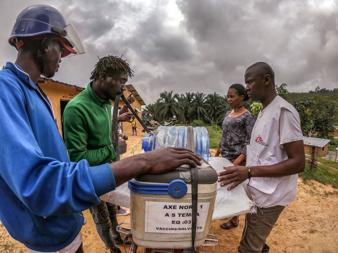 A motorcycle driver loads vaccines to be transported further in rural areas in western DRC on March 3, 2020.