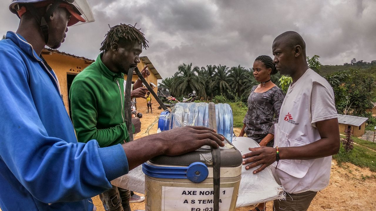 A motorcycle driver loads vaccines to be transported further in rural areas in western DRC on March 3, 2020.