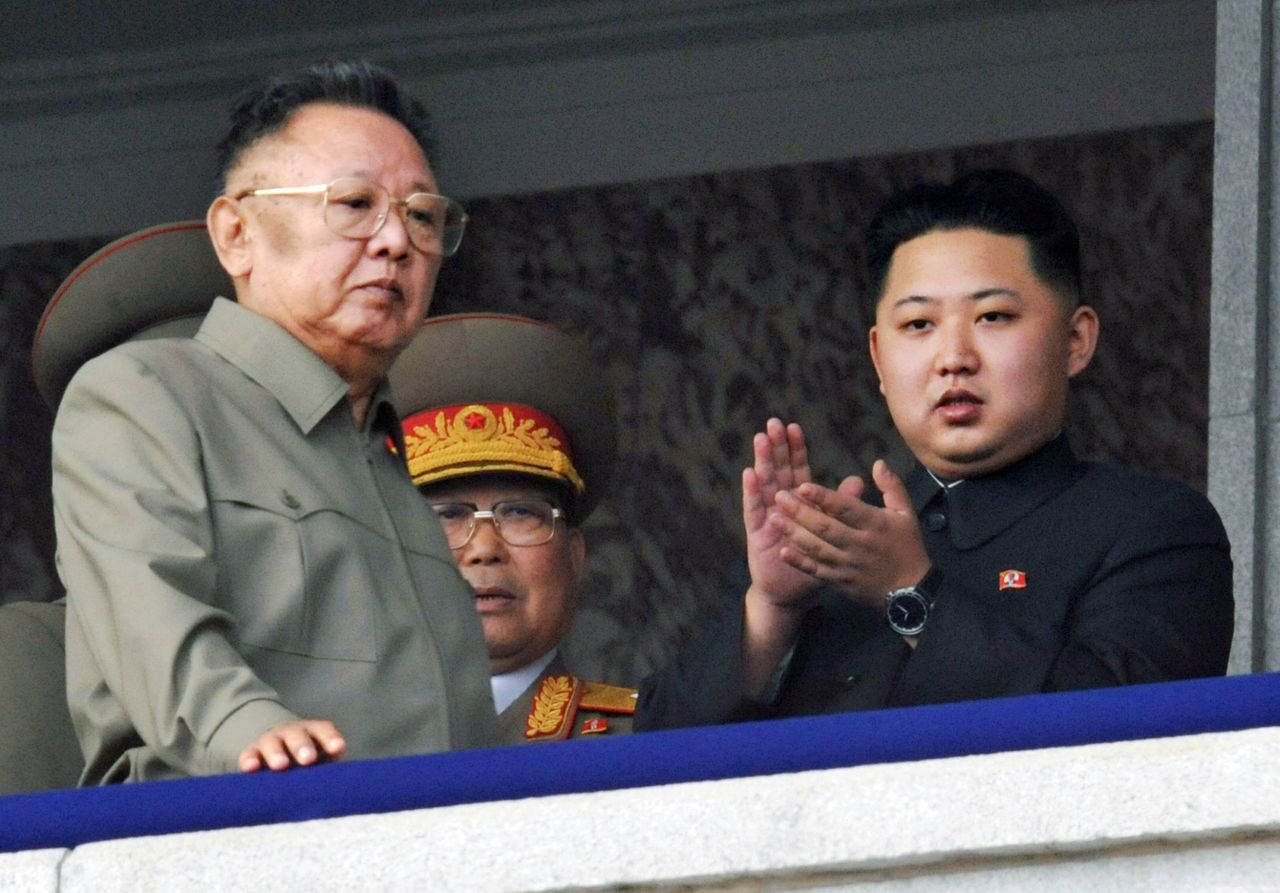 Kim attends a military parade alongside his father, left, in October 2010.