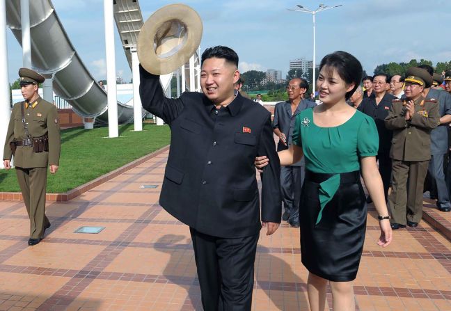 Kim is accompanied by his wife, Ri Sol Ju, at an event in Pyongyang in July 2012.