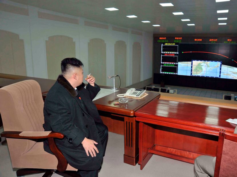 In this December 2012 photo provided by North Korea's state-run news agency, Kim smokes a cigarette after the launch of a rocket carrying a satellite.