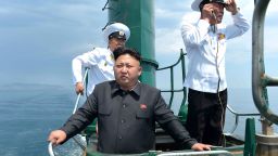 North Korean leader Kim Jong Un (front) stands on the conning tower of a submarine during his inspection of the Korean People's Army (KPA) Naval Unit 167 in this undated photo released by North Korea's Korean Central News Agency (KCNA) in Pyongyang June 16, 2014. REUTERS/KCNA (NORTH KOREA - Tags: POLITICS MILITARY MARITIME TPX IMAGES OF THE DAY)  ATTENTION EDITORS - THIS PICTURE WAS PROVIDED BY A THIRD PARTY. REUTERS IS UNABLE TO INDEPENDENTLY VERIFY THE AUTHENTICITY, CONTENT, LOCATION OR DATE OF THIS IMAGE. FOR EDITORIAL USE ONLY. NOT FOR SALE FOR MARKETING OR ADVERTISING CAMPAIGNS. THIS PICTURE IS DISTRIBUTED EXACTLY AS RECEIVED BY REUTERS, AS A SERVICE TO CLIENTS. NO THIRD PARTY SALES. NOT FOR USE BY REUTERS THIRD PARTY DISTRIBUTORS. SOUTH KOREA OUT. NO COMMERCIAL OR EDITORIAL SALES IN SOUTH KOREA