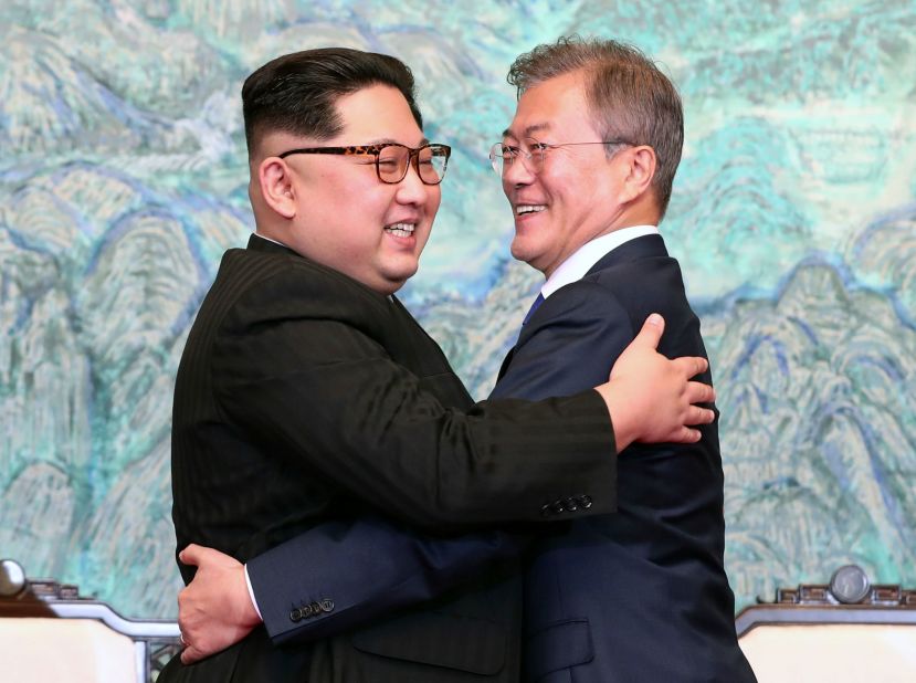 Kim and Moon embrace after signing a joint statement at their summit in April 2018.