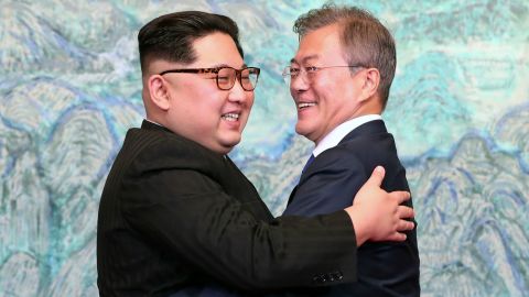 Kim and Moon embrace after signing a joint statement at their summit in April 2018.