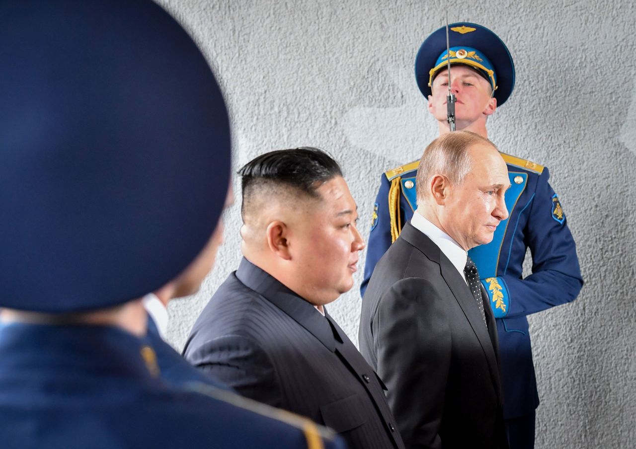 Kim and Putin pass by guards during their meeting in Vladivostok, Russia.