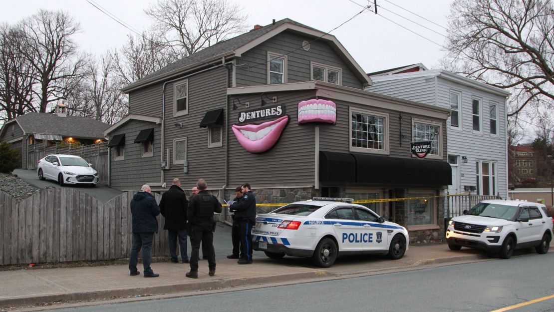 Investigators gather outside Nova Scotia clinic owned by the gunman who police said was responsible for a killing spree.