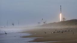 A SpaceX Falcon 9 rocket carrying 60 Starlink satellites forms a vapor cone after launching from pad 39A at the Kennedy Space Center in Florida as seen from Playalinda Beach at Canaveral National Seashore near Titusville, Florida on March 18, 2020. This is the sixth Starlink mission designed to provide global high-speed internet service.  (Photo by Paul Hennessy/NurPhoto via Getty Images)