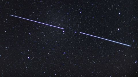 Two of the satellites shown here over Germany in an image made with a 15 second exposure.