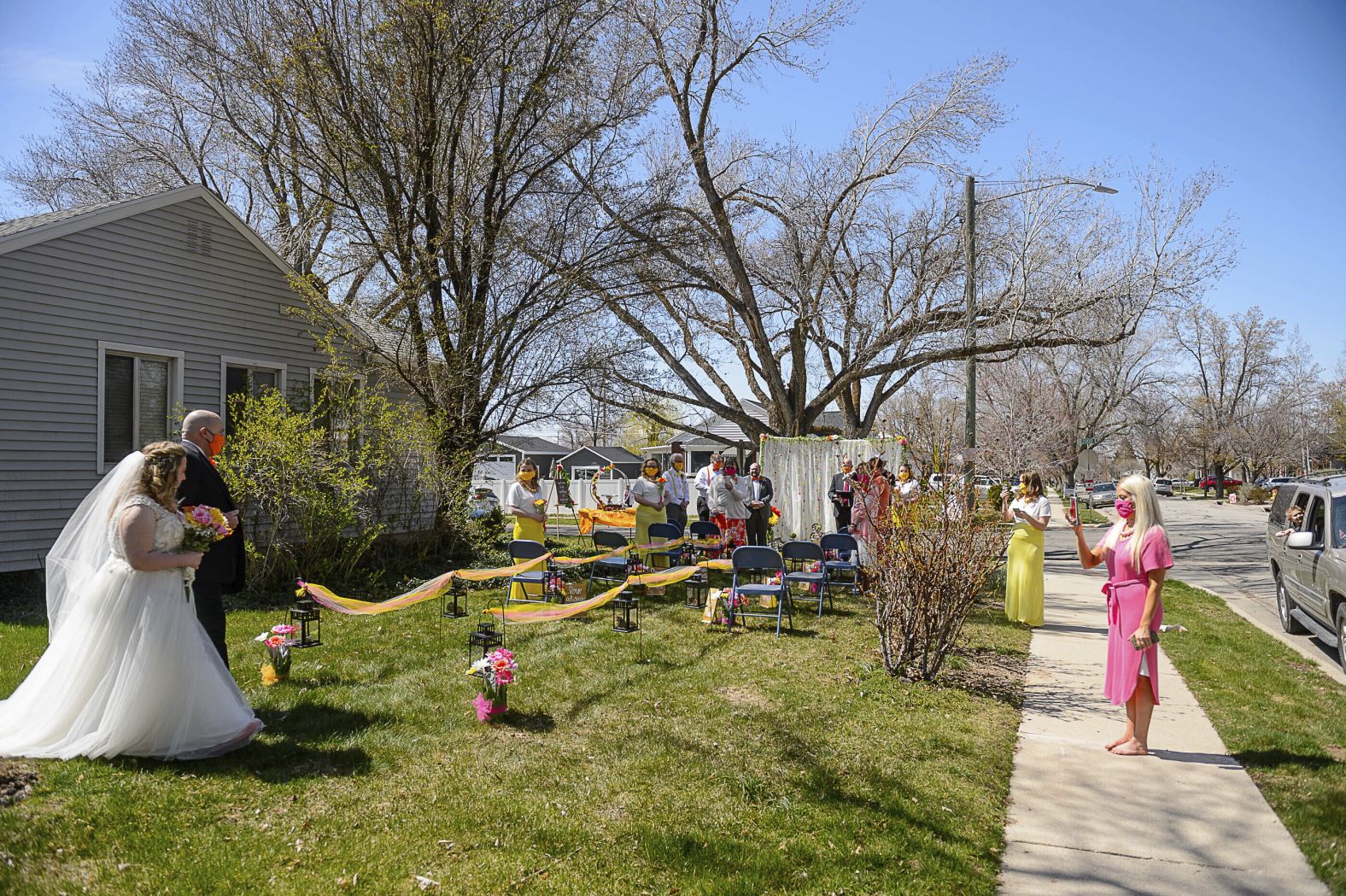 Kadie Smeding walks the aisle to marry Tyler van Roosendaal in a Salt Lake City yard on April 4.