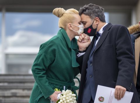 A couple kisses after their wedding ceremony, which included only witnesses, in Vilnius, Lithuania, on April 3.