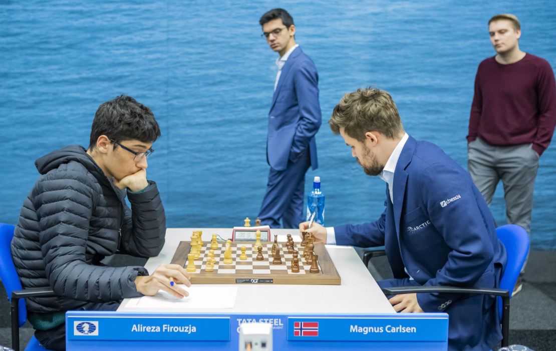 Firouzja (L) against Carlsen during the ninth round of the Tata Steel Chess Tournament in Wijk aan Zee, the Netherlands.