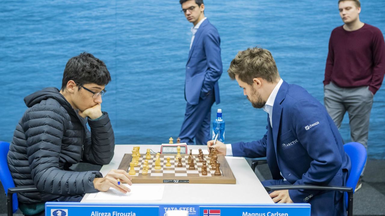 Firouzja (L) against Carlsen during the ninth round of the Tata Steel Chess Tournament in Wijk aan Zee, the Netherlands.