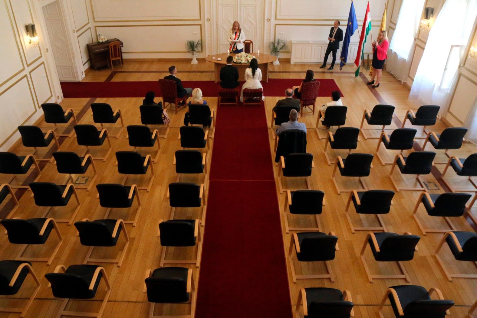 Gyorgy David Jablonovszky and Timea Jablonovszky attend their wedding ceremony with some family members at the town hall of Miskolc, Hungary, on March 28.