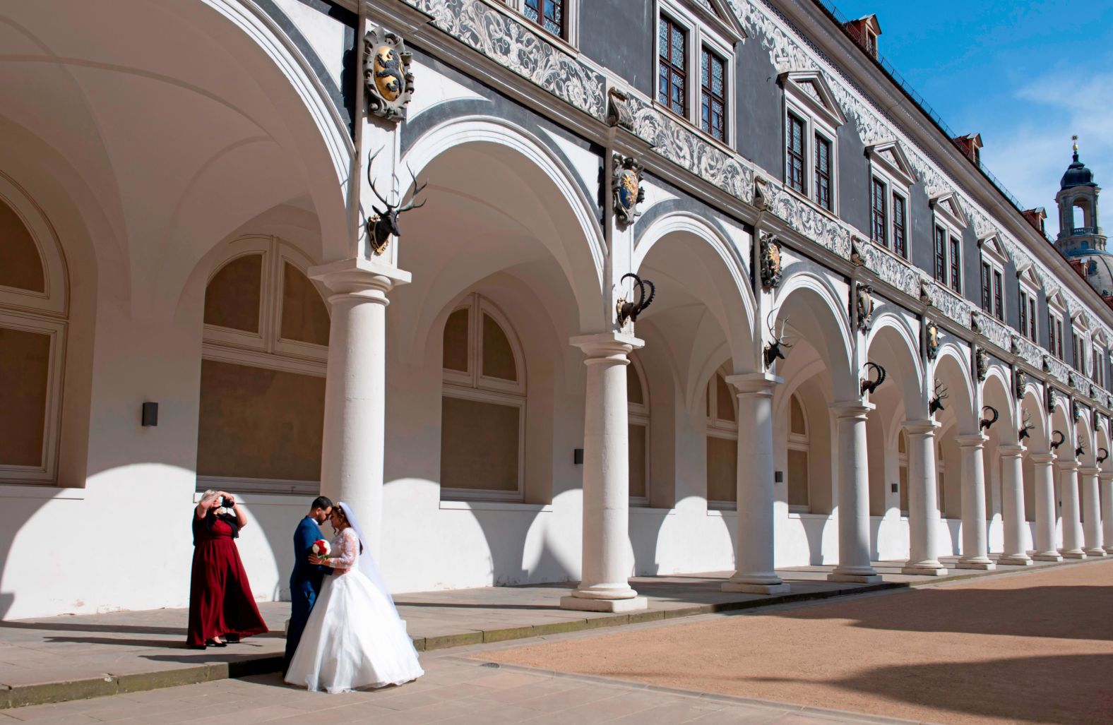 Just-married couple Boualem and Laila Bellil are photographed by Laila's mother in a courtyard in Dresden, Germany on March 26. They celebrated without wedding guests.