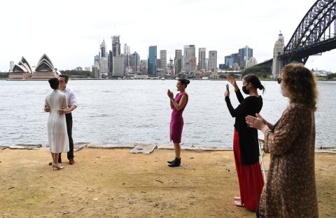 Lara Laas and Daniel Clark are married at Sydney's Captain Henry Waterhouse Reserve in Kirribilli, Australia, on March 28.