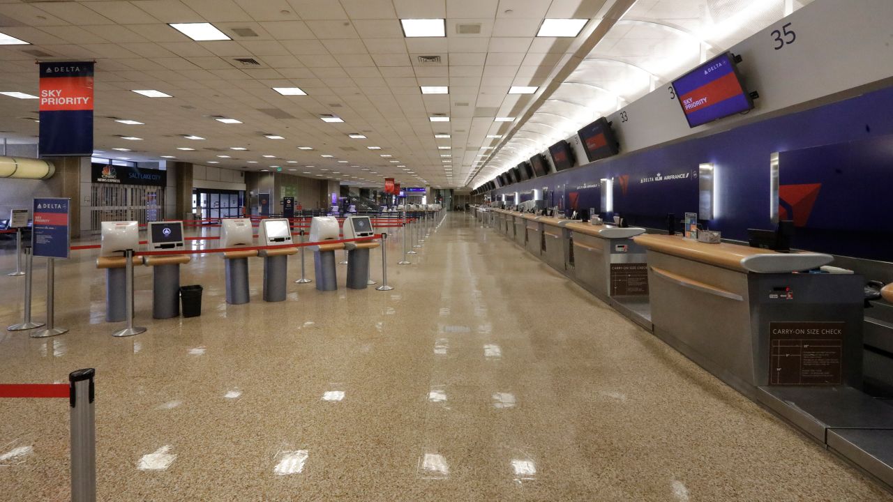 An empty delta ticket counter is shown at Salt Lake City International Airport Tuesday, April 7, 2020, in Salt Lake City. Airlines are suffering significantly as governments around the world urge people to stay at home to slow the spread of the coronavirus. The number of travelers screened last Thursday at U.S. airports was down 95% from the same day last year. Airlines such as Delta, American, United, Southwest and JetBlue have said they are applying for their share of $25 billion in federal grants designed to cover airline payrolls for the next six months. (AP Photo/Rick Bowmer)