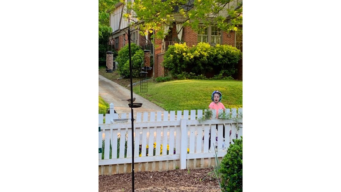 8-year-old Ellis Radtke is excited that a bird is enjoying the family's new bird feeder in Atlanta.