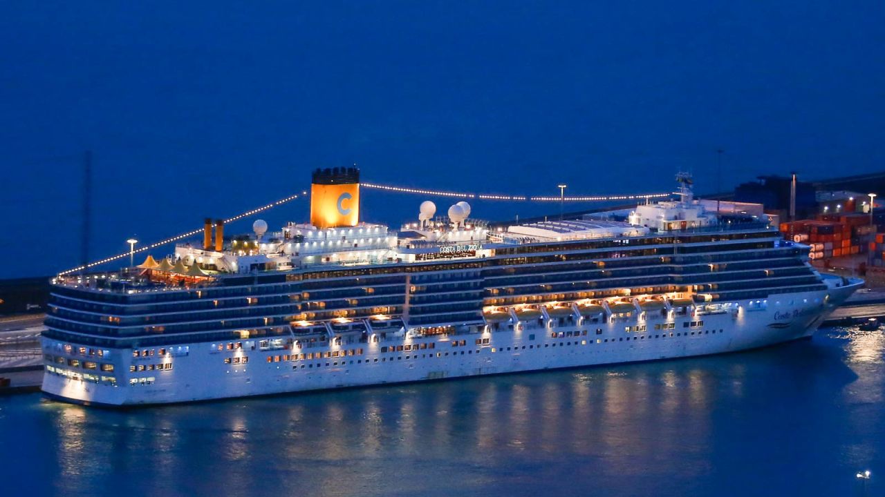 The Costa Deliziosa is docked at the port of Barcelona early on April 20, 2020. - After five weeks without touching land due to the restrictions linked to the coronavirus, a group of the 1,800 passengers on board the cruise ship were able to disembark in Barcelona, the penultimate stopover of an atypical world tour that will end in Italy. (Photo by Pau BARRENA / AFP) (Photo by PAU BARRENA/AFP via Getty Images)