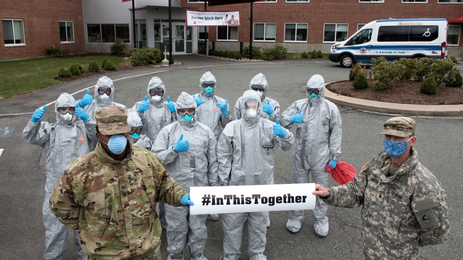 Members of the Massachusetts National Guard complete COVID-19 testing on residents at a nursing home in Brockton, Mass.