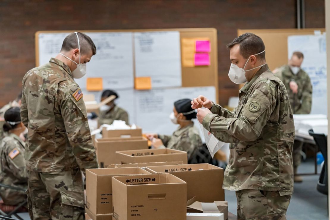 New York Army National Guard members assemble novel coronavirus specimen collection test kits at the New York State Department of Health's Wadsworth Center in Albany.