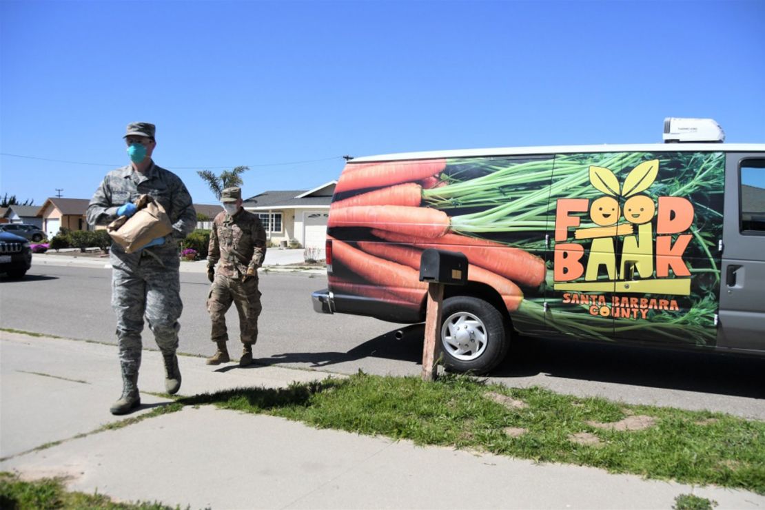 Space operators for the California Air National Guard's 216th Space Control Squadron deliver food to residences in Orcutt, California.